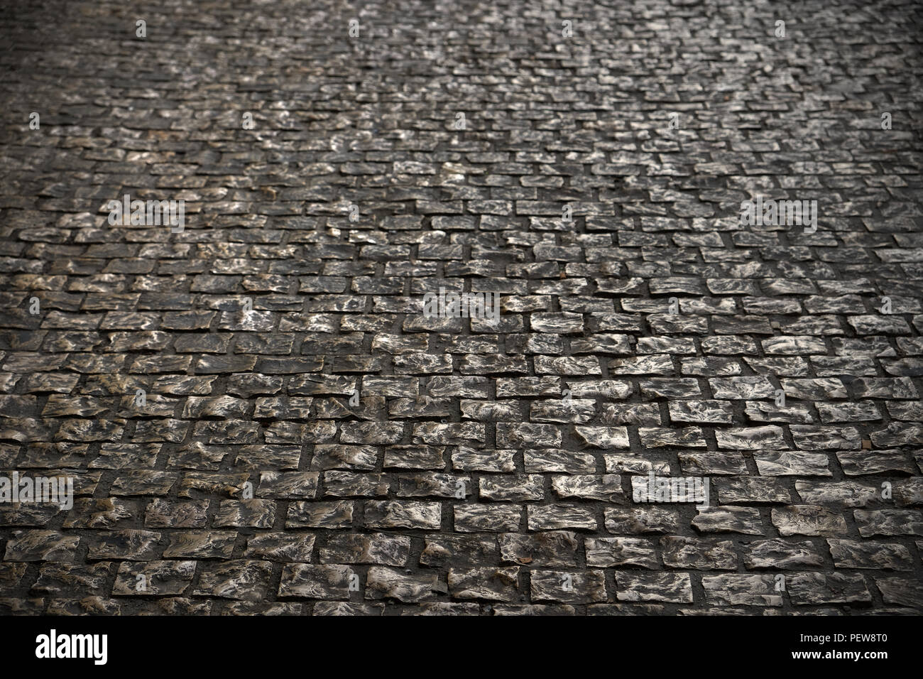 Alten gepflasterten Straße dunkle Oberfläche Hintergrund Textur Stockfoto