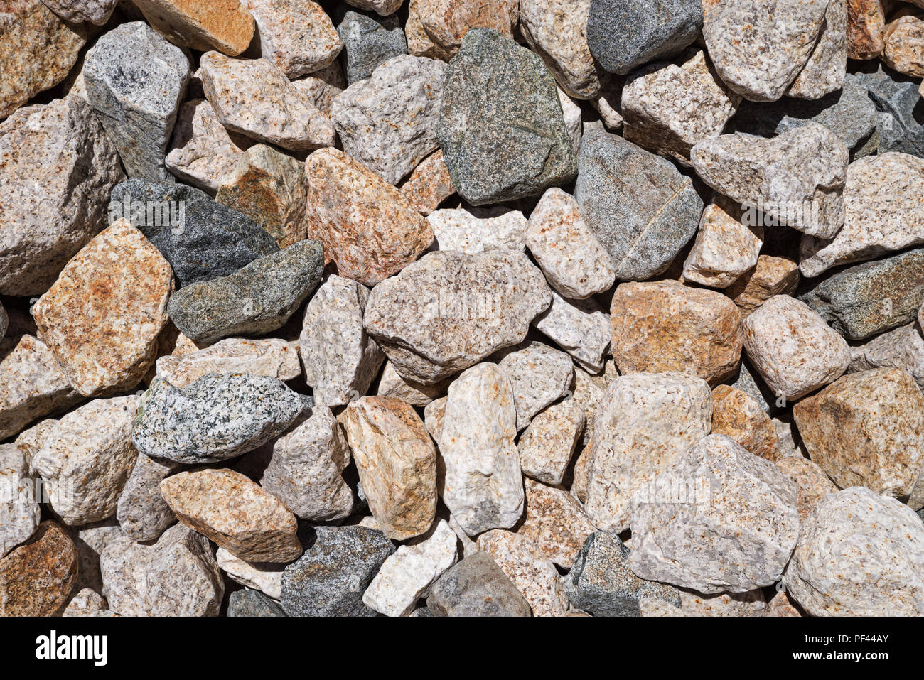 Abgenutzte gemischt magmatischen Cobble rock Hintergrund Textur Stockfoto