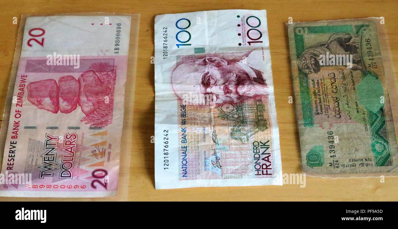 Zwanzig Dollar Bank von Simbabwe, 10 Rupien Zentralbank von Sri Lanka, 100 Cent Francs Banque Nationale de Belgique Stockfoto
