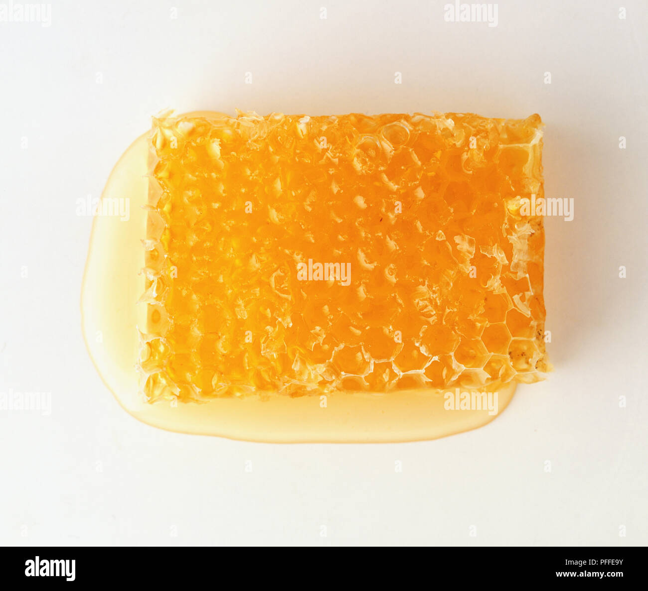 Honeycomb Tropfen Honig Stockfoto