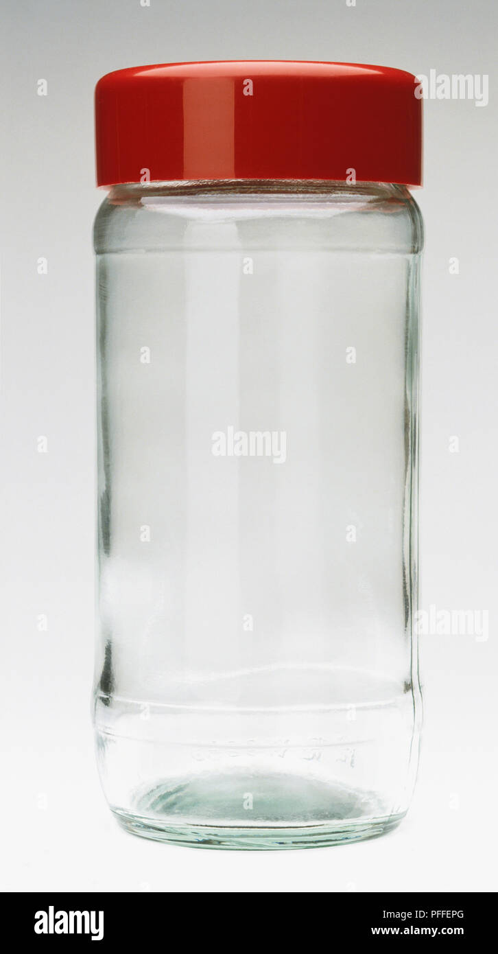 Eine leere klar Glas Glas mit rotem Deckel Stockfoto