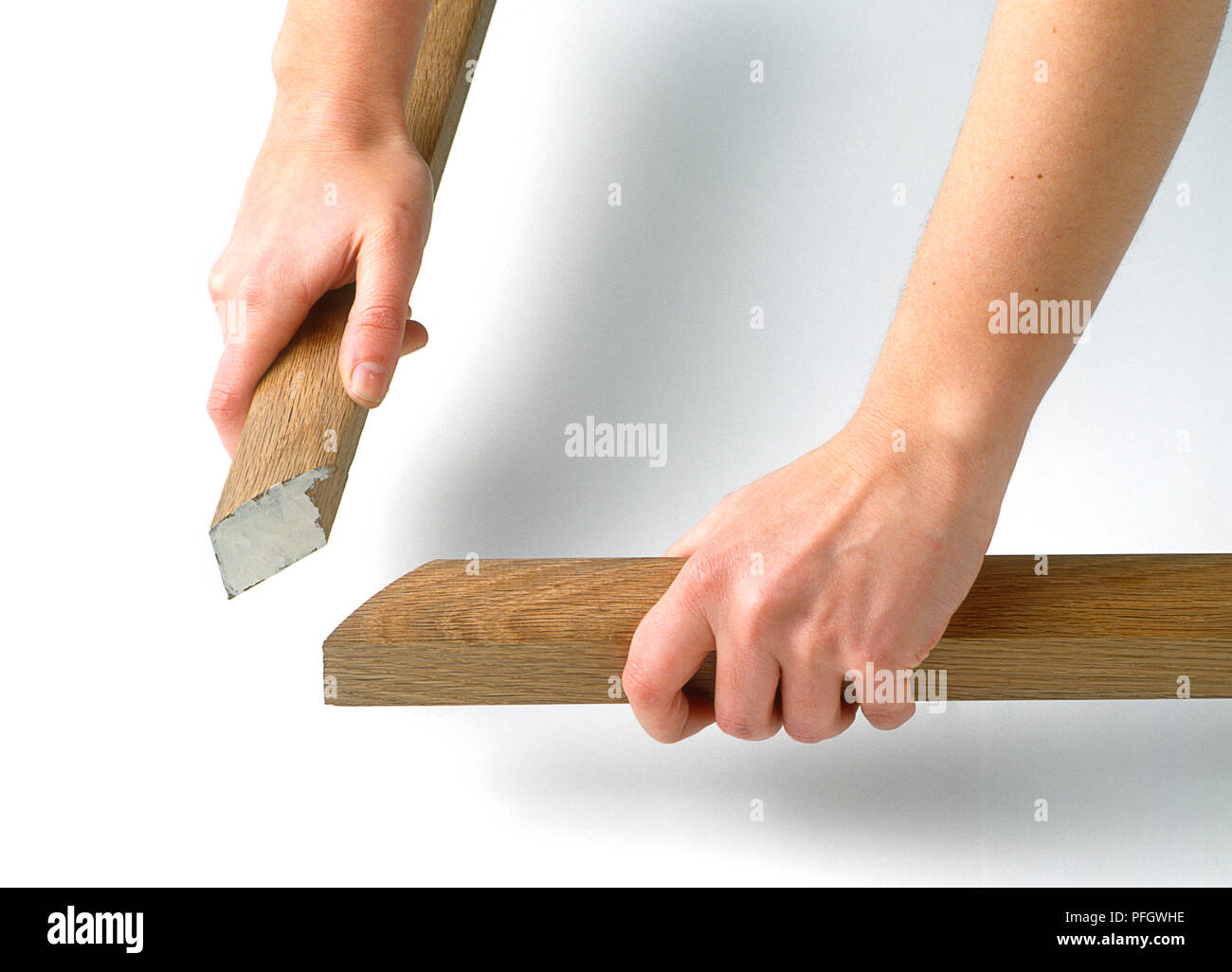 Die Hände zusammen, zwei Stücke Holz (Rahmen) Stockfoto