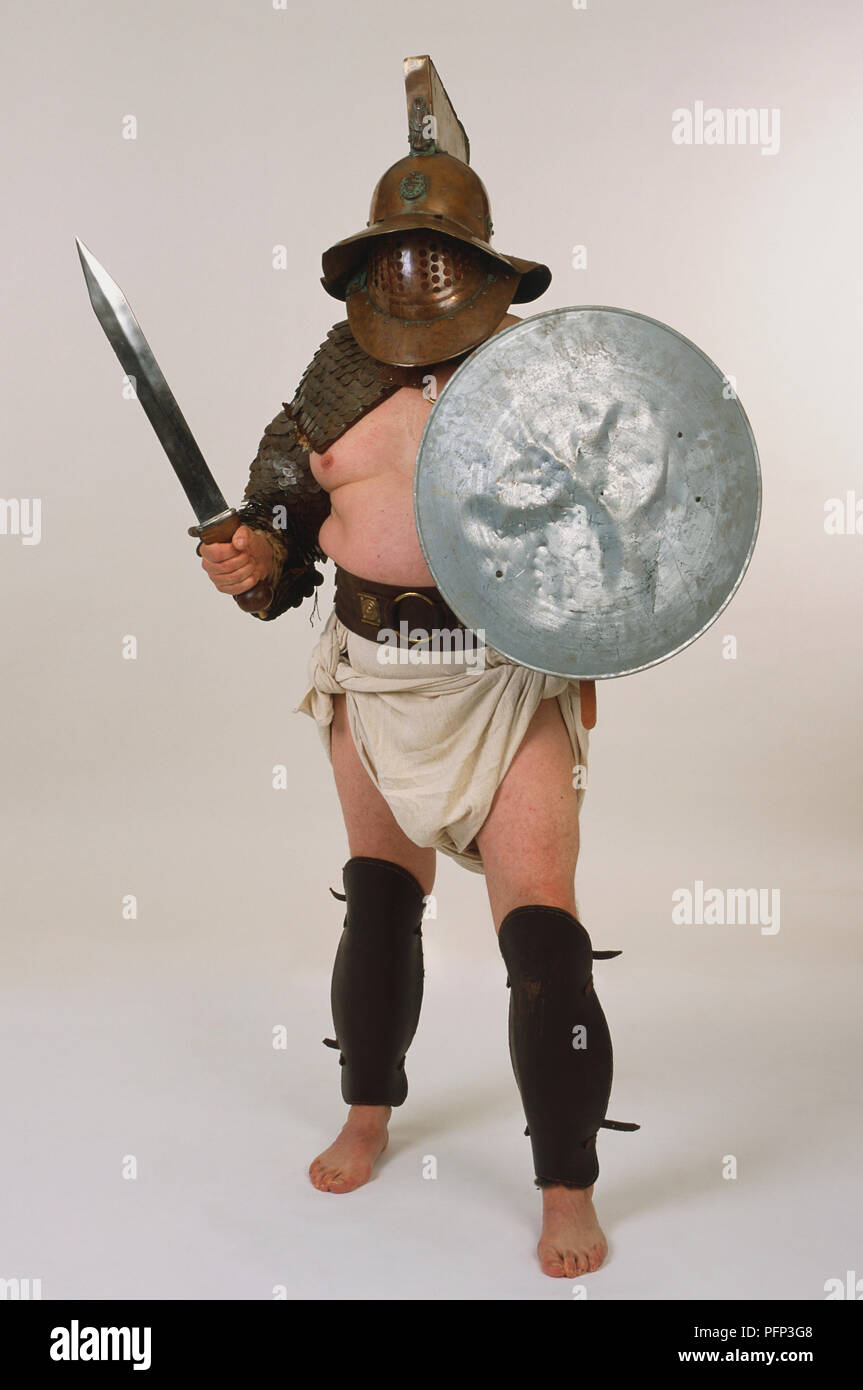 Mann gekleidet wie der Römische gladiator bin urmillo', mit Schwert und Schild. Stockfoto
