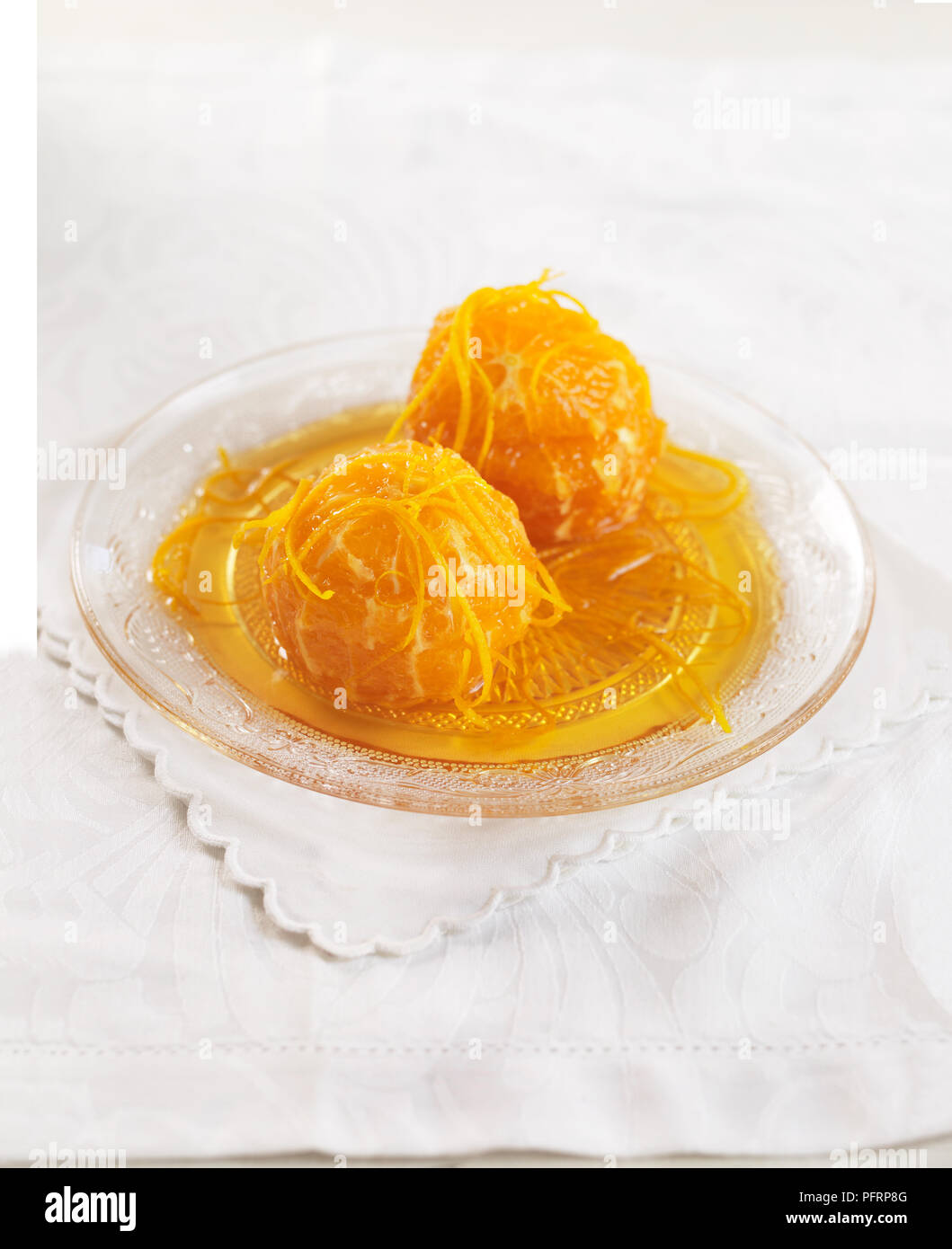Karamellisierten Orangen auf einer Glasplatte Stockfoto