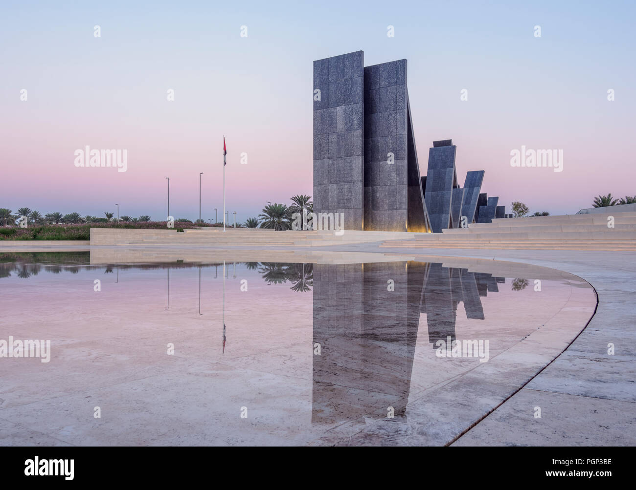 Wahat al Karama Monument, das an der Dämmerung, Abu Dhabi, Vereinigte Arabische Emirate Stockfoto