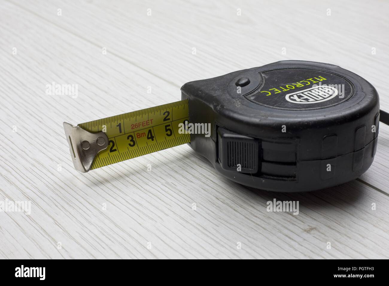 Maßband, einziehbar, in metrischen und zölligen measuremnts Stockfoto