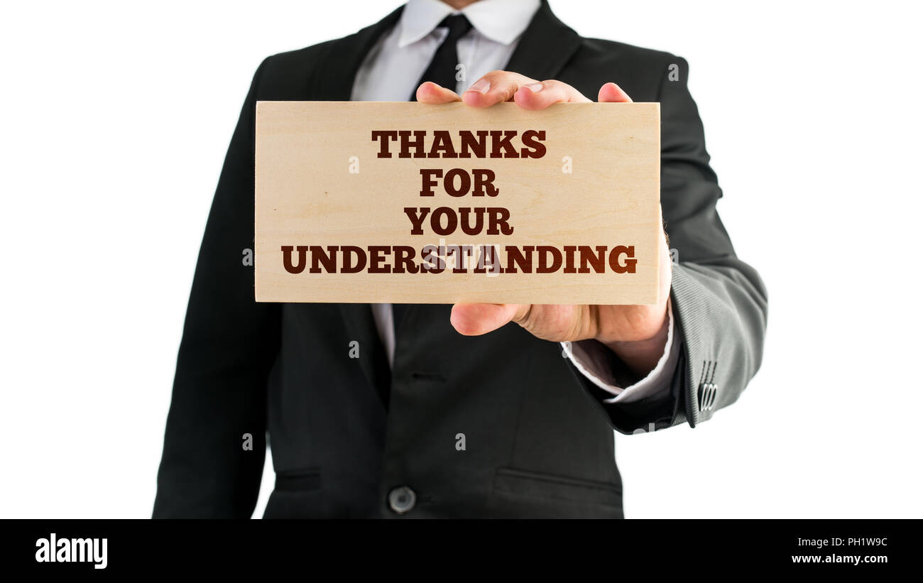 Geschäftsmann mit einem Schild in der Hand lesen - Vielen Dank für Ihr Verständnis - in der Wertschätzung der Kunden, die von der Unternehmen stehen in Zeiten der Str Stockfoto