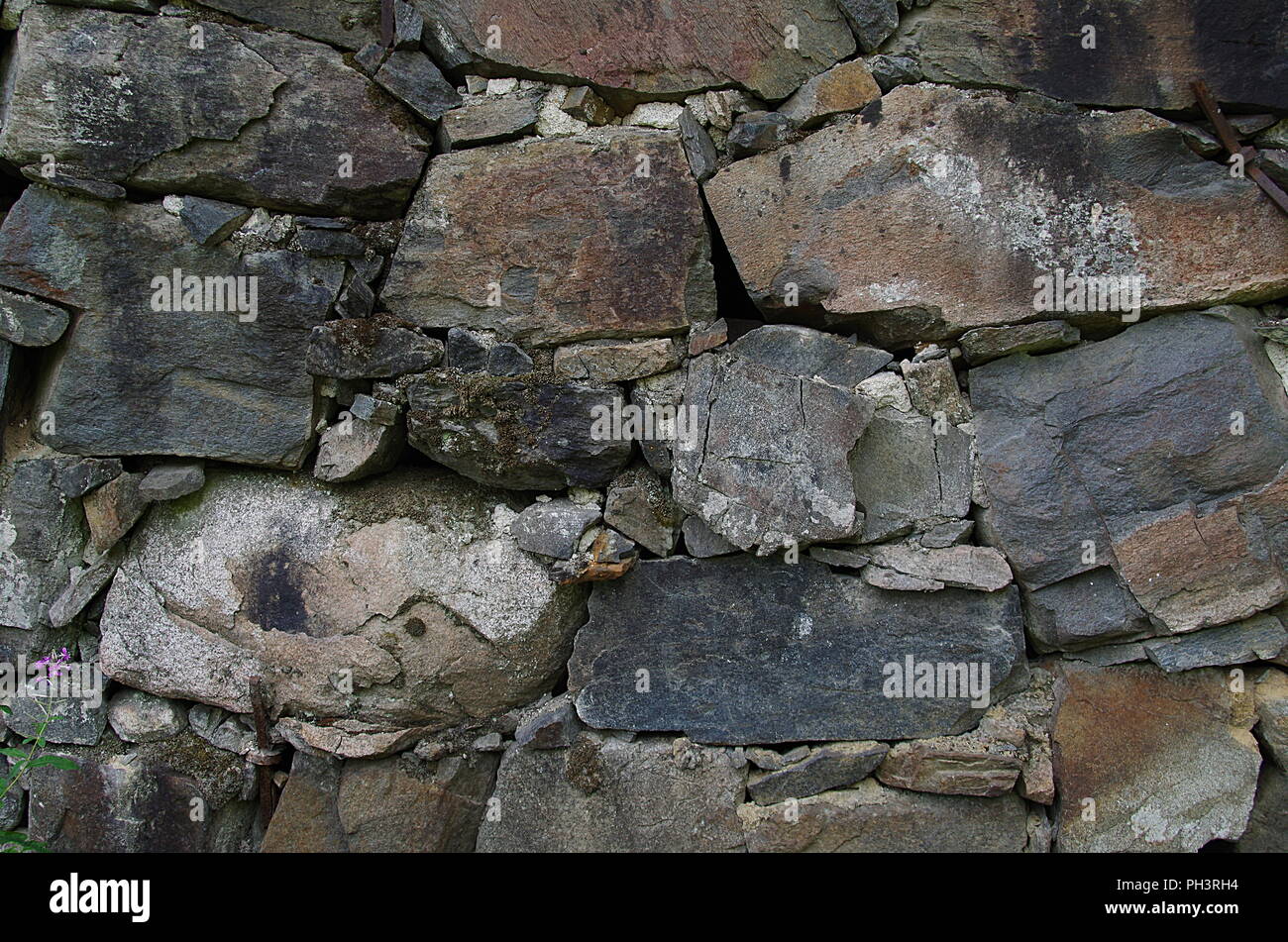 Eine Steinmauer mit interessanter Struktur Stockfoto