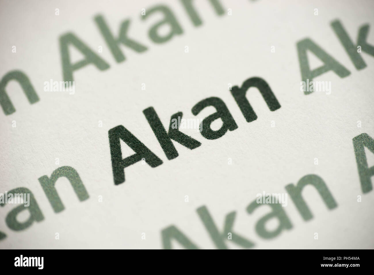 Wort Akan Sprache auf weißem Papier Makro gedruckt Stockfoto