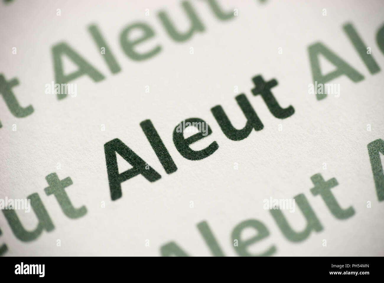 Aleut Word Makro Sprache auf weißem Papier gedruckt Stockfoto