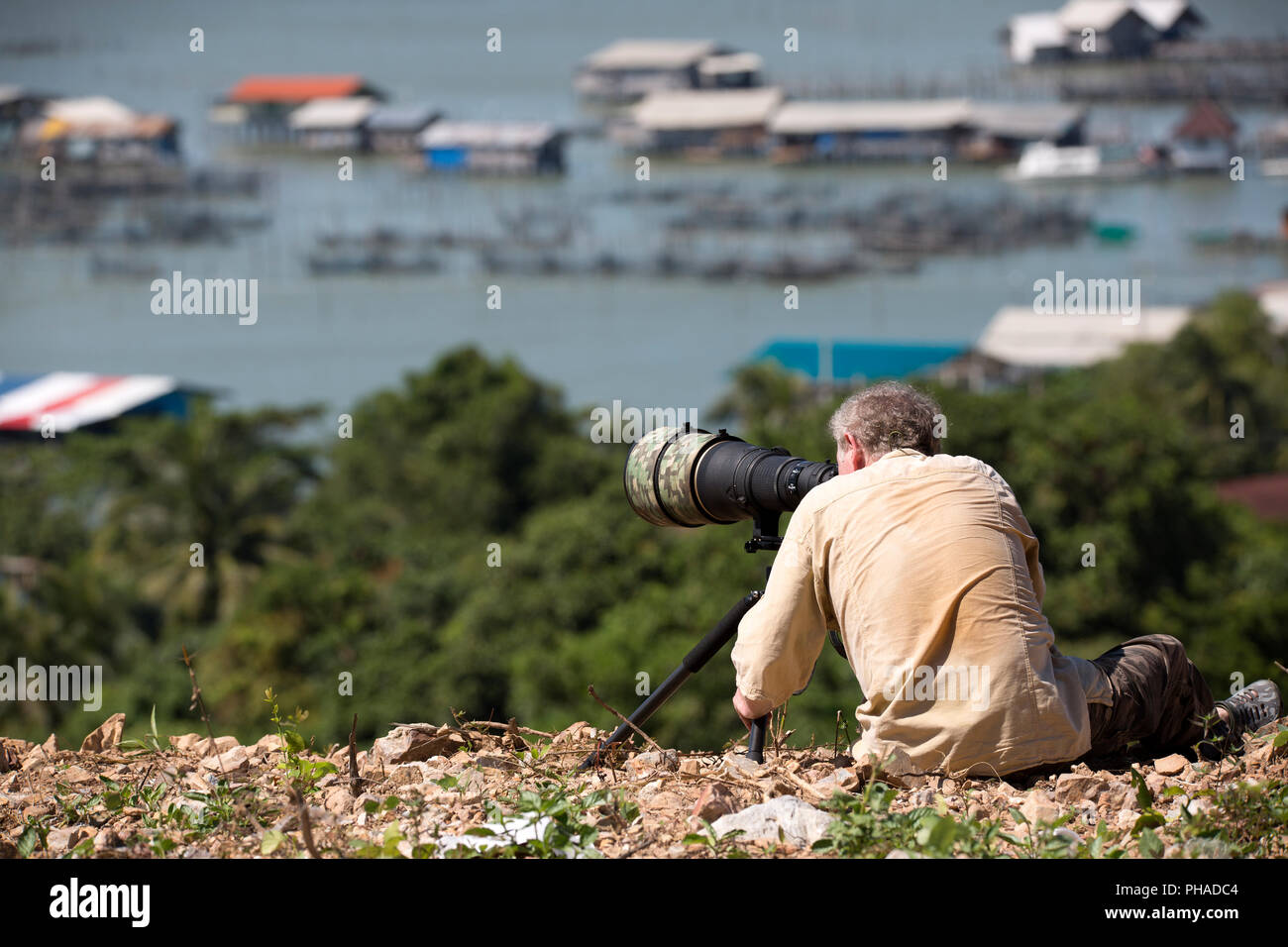 Fotograf mit einem großen Objektiv (600 mm) Stockfoto