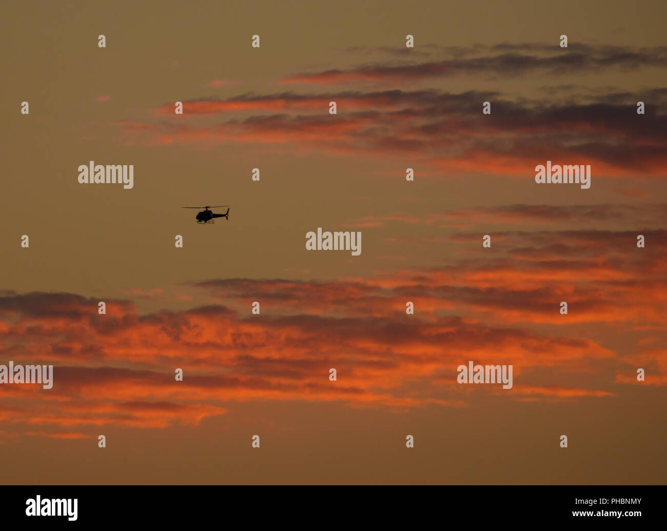 Hubschrauber bei Sonnenuntergang Stockfoto