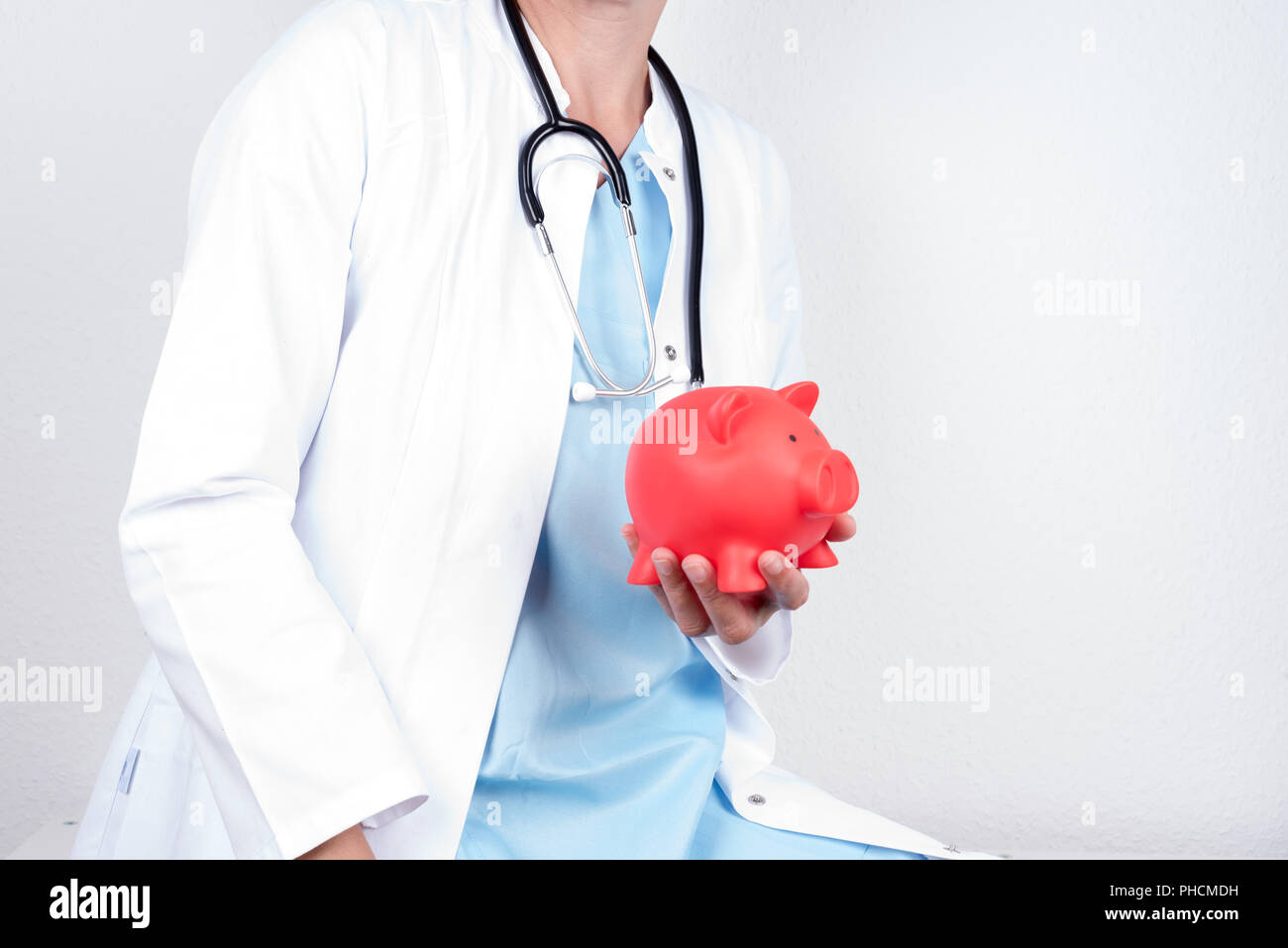 Arzt mit Geld, Stockfoto