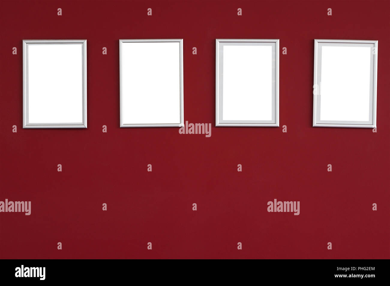 Die reale rote Wand mit Frames Stockfoto