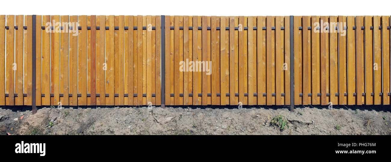 Lange neuen gelben Zaun Stockfoto