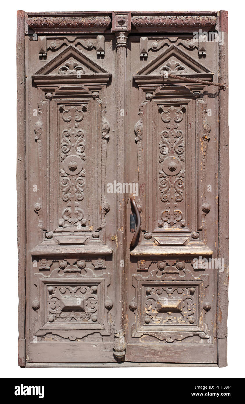 Eine sehr alte archaische Holztür ist braun lackiert. Stockfoto