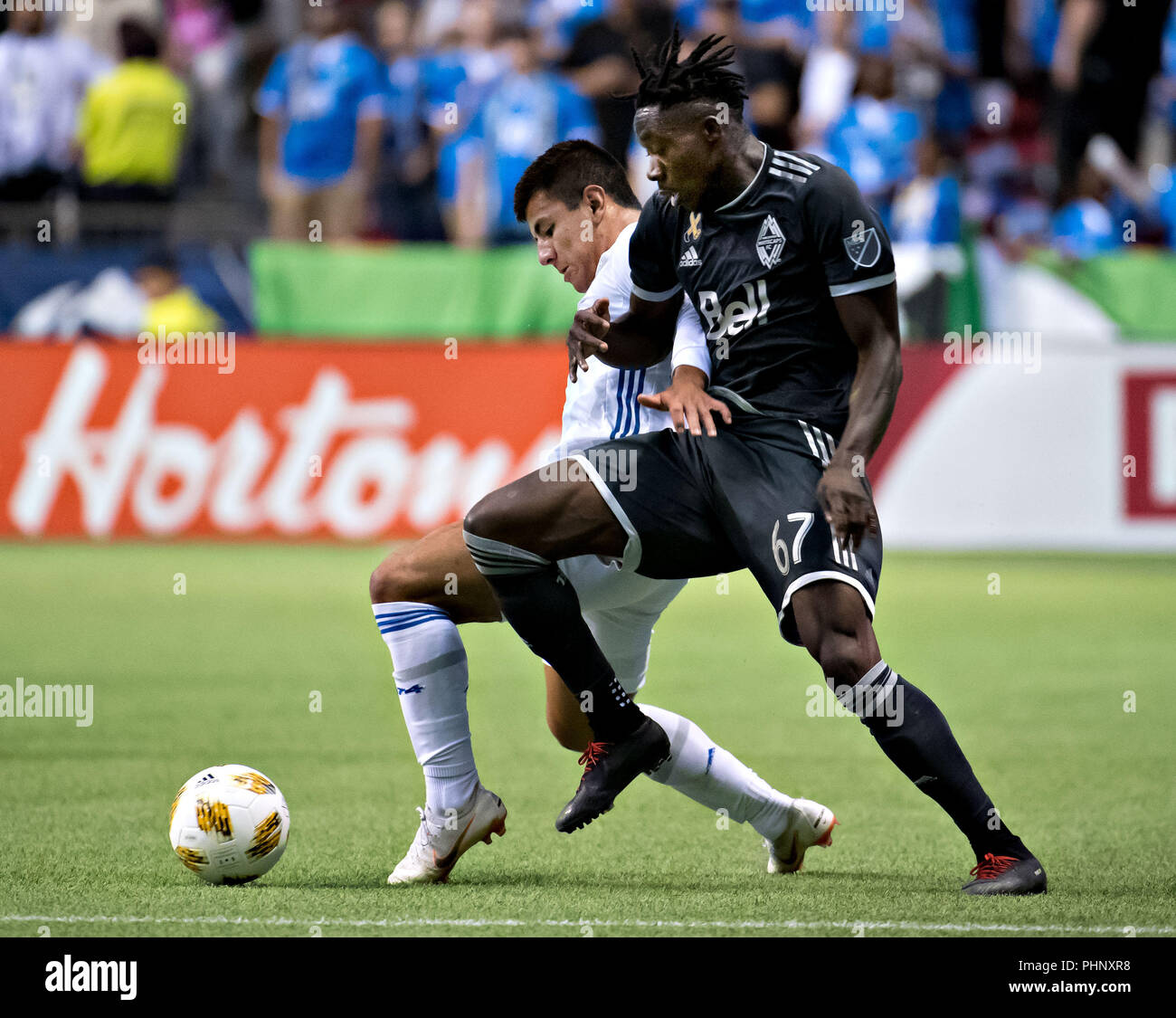 Vancouver, Kanada. 1. Sep 2018. San Jose Earthquakes" Nick Lima (L) Mias mit Vancouver Whitecaps" alphonso Davies während der 2018 Major League Soccer (MLS) Übereinstimmung zwischen Vancouver Whitecaps und San Jose Earthquakes in BC Place in Vancouver, Kanada, an Sept. 1, 2018. Vancouver Whitecaps gewann 2-0. Credit: Andrew Soong/Xinhua/Alamy leben Nachrichten Stockfoto