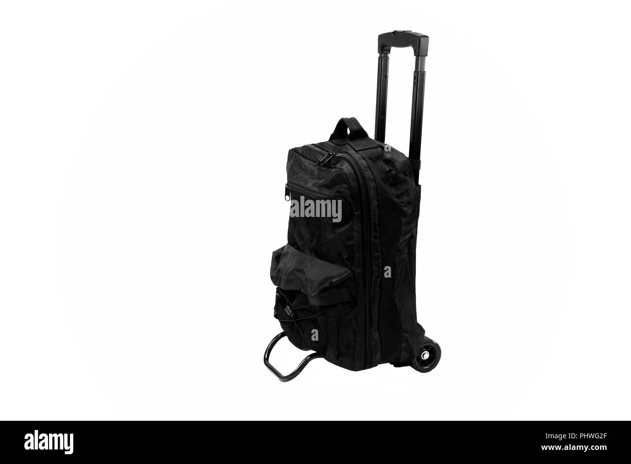 Schwarz Gepäck Tasche auf Rädern mit der Ausdehnung der Griff isoliert Stockfoto