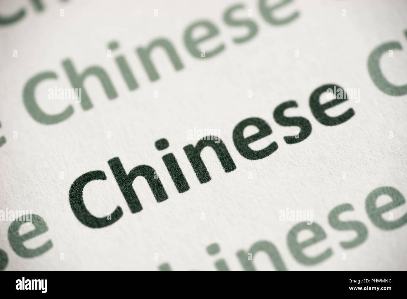 Wort chinesische Sprache auf weißem Papier Makro gedruckt Stockfoto