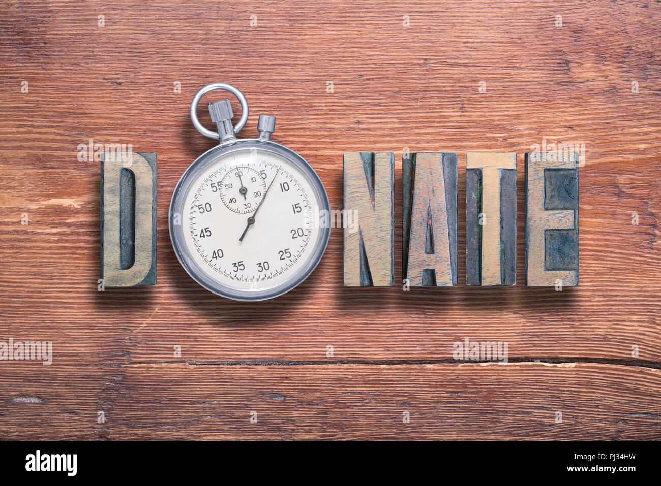 Wort kombiniert auf vintage Spenden lackierten Holz- Oberfläche mit Stoppuhr innen Stockfoto
