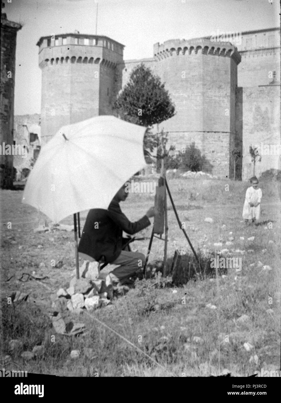 Baldomer Gili Roig. Baldomer Gili Roig pintant davant La Muralla de Poblet, C. 1900. Stockfoto