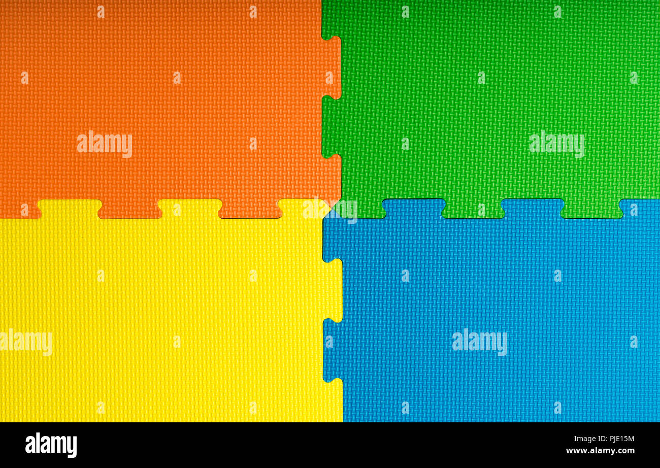 Schaum Bodenbeläge Fliesen/Matten in einem Spielzimmer, Kindergarten oder Fitnessraum. Mögliche Verwendung als einen farbigen Hintergrund mit kopieren. Stockfoto