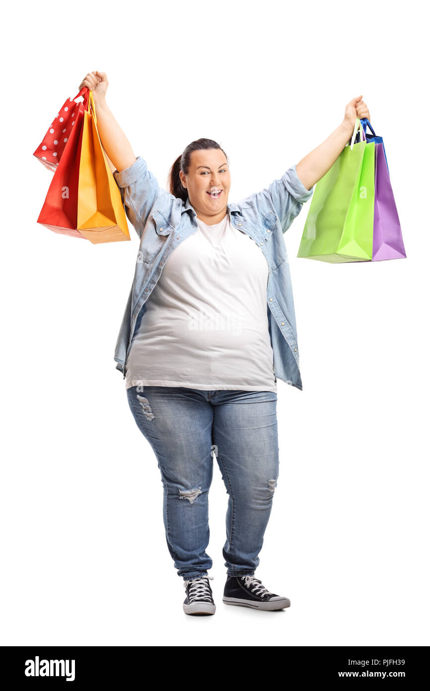 In voller Länge Porträt einer überglückliche Frau mit Einkaufstüten auf weißem Hintergrund Stockfoto