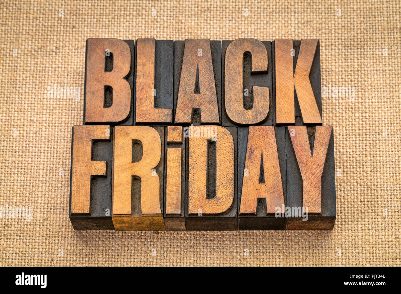 Schwarzer Freitag, Holiday Shopping Event-Banner in Vintage buchdruck Holz Bausteine gegen Leinwand Leinwand Stockfoto
