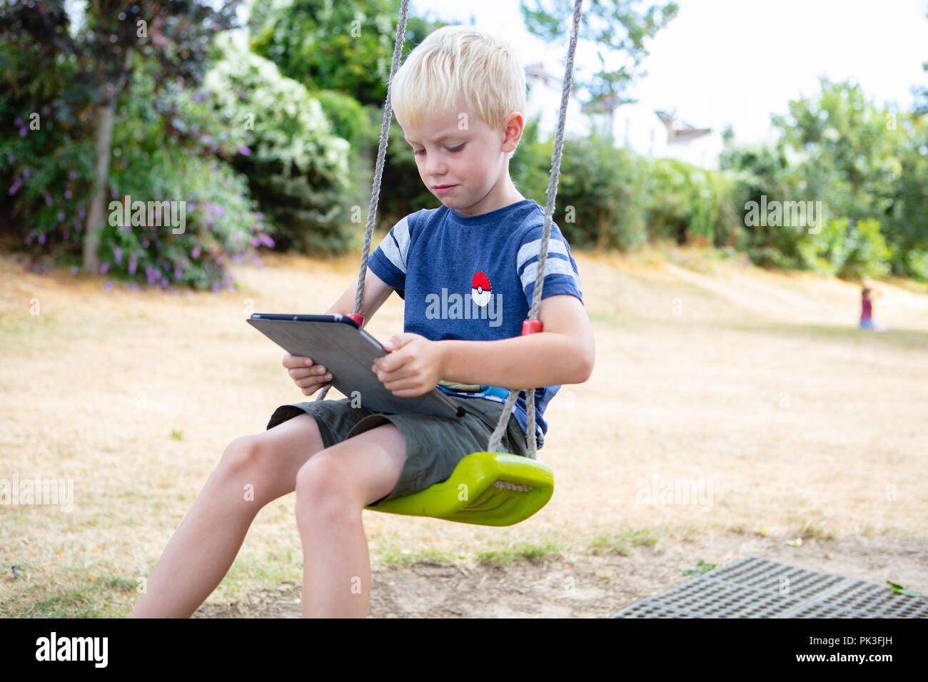 Kinder mit iPad und iPhone Stockfoto