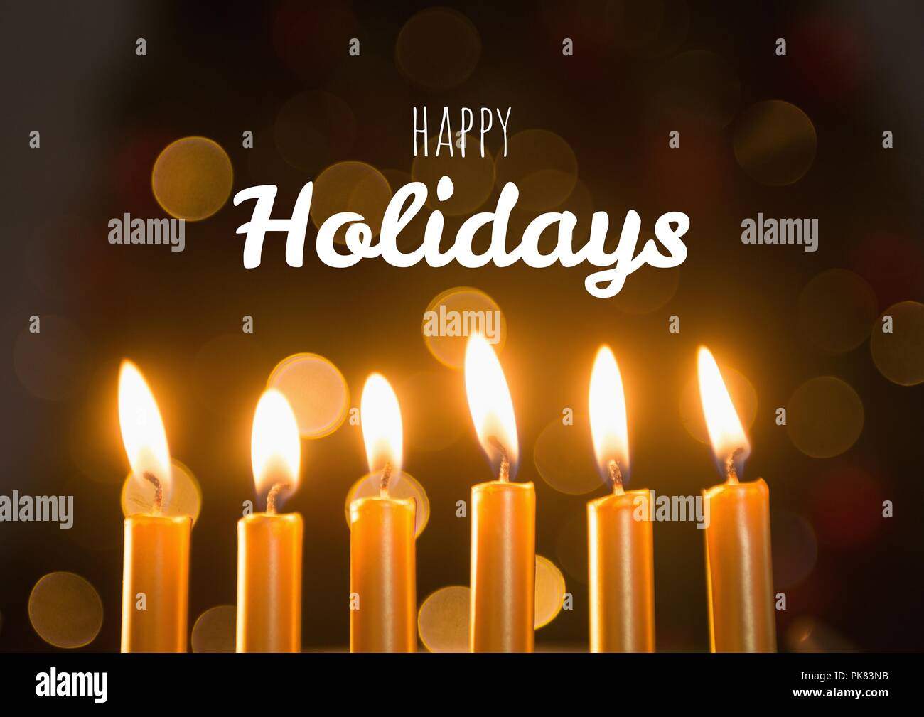 Happy holidays Text mit Kerzen Stockfoto