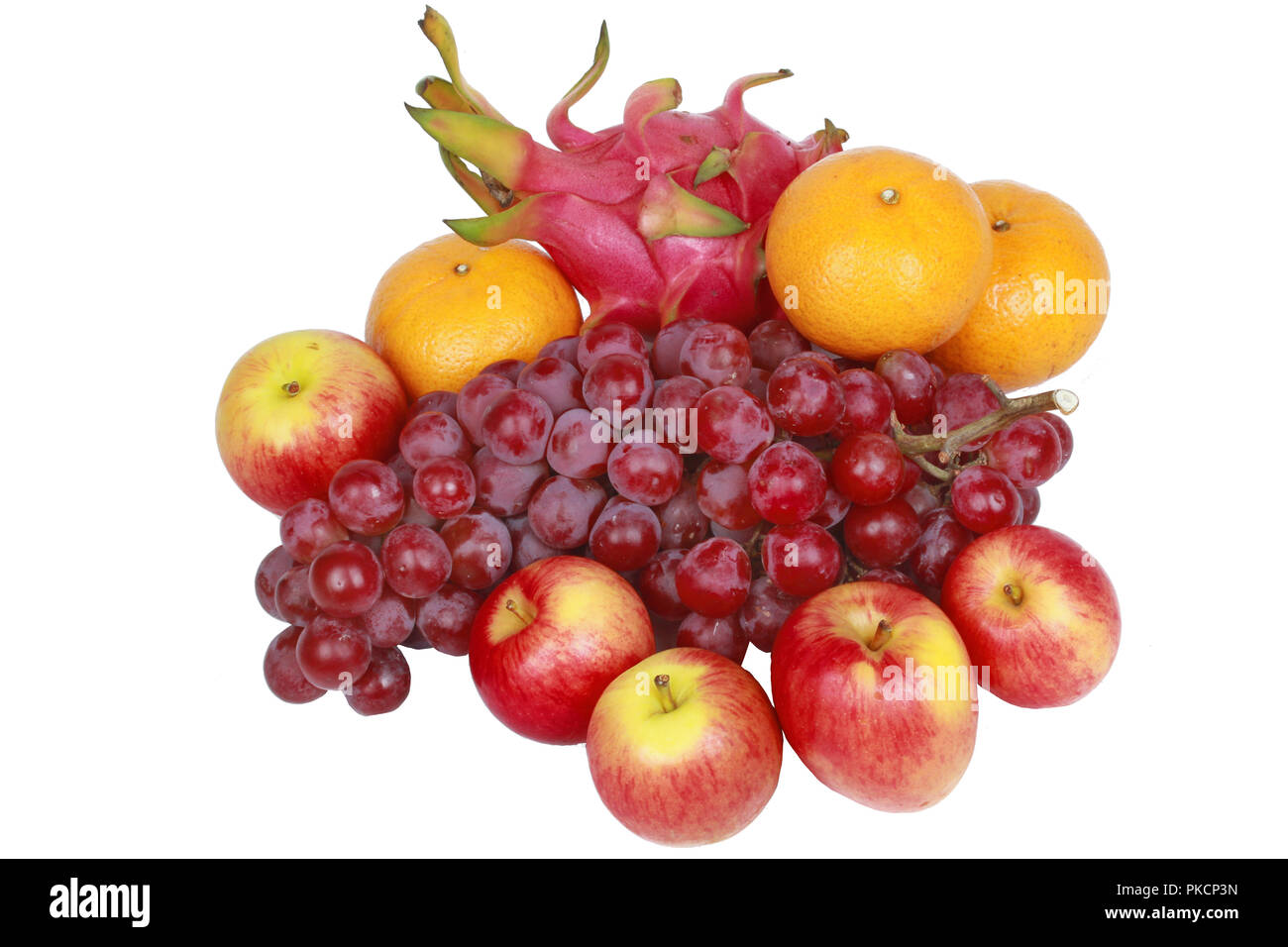 Der Nahrung für Gesundheit isoliert, gemischtes Obst als Rote kernlose Trauben, Orangen, Apfel, Drachenfrucht, Japanisch goldene Melone. Kein Fleisch Rezept. Stockfoto