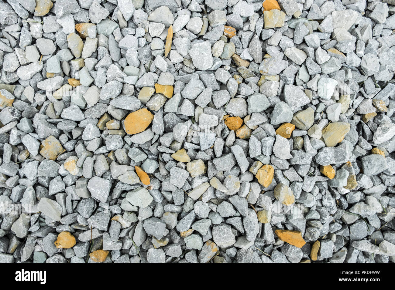 Kies mit weißen und gelben Kies/Textur Hintergrund Stockfoto