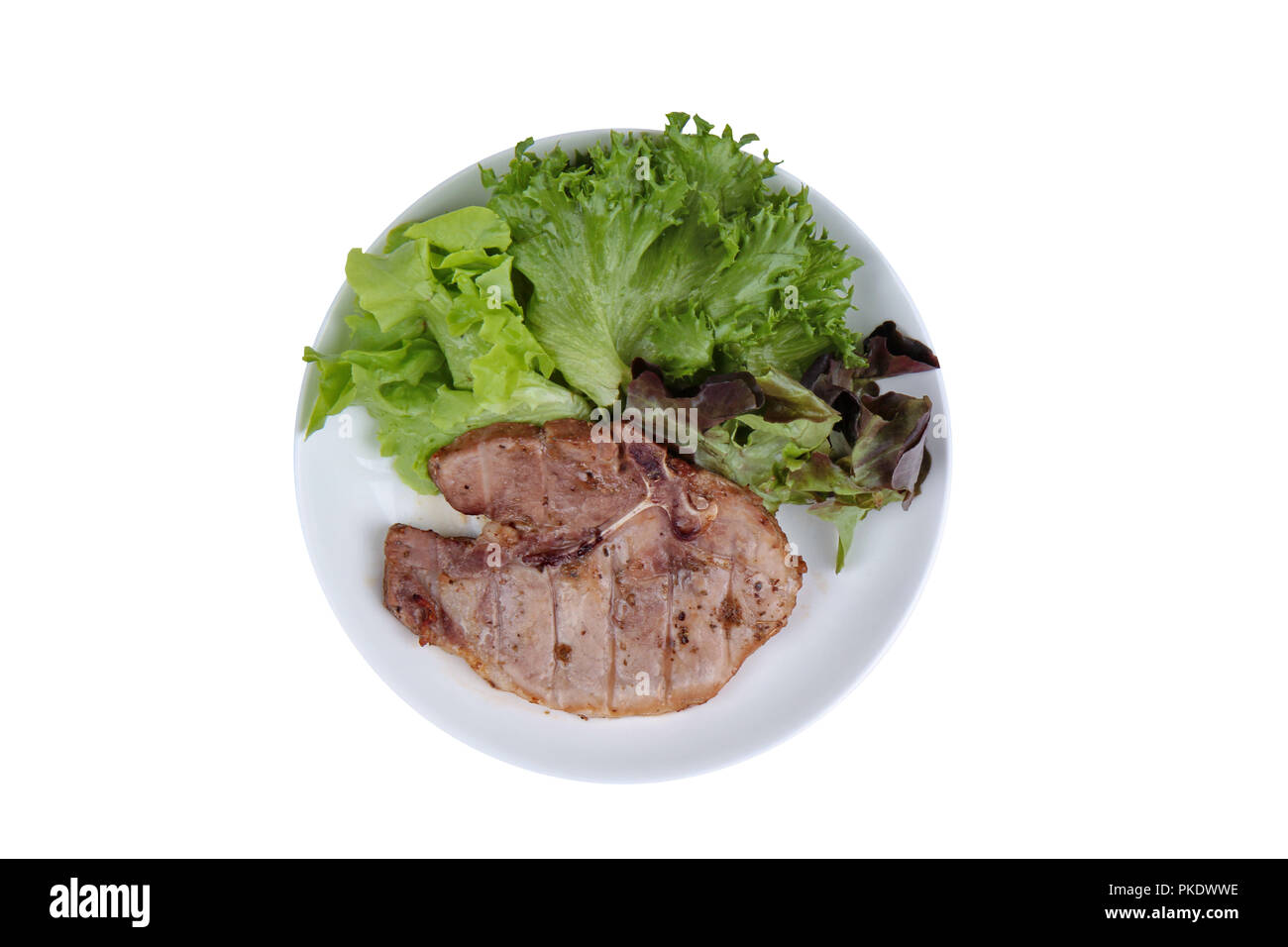 Hausmannskost von Schweinefleisch Steak Chop serviert mit gemischten Gemüse wie rote Eiche, grüne Eiche und Salat Stockfoto