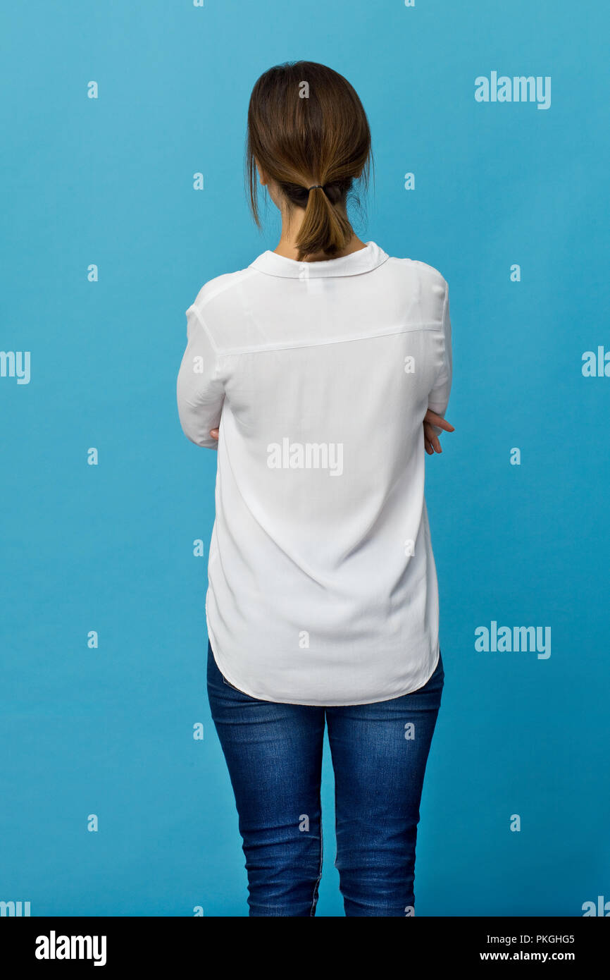 Junge Frau mit braunen Haaren zurück Portrait. Ansicht von hinten Stockfoto