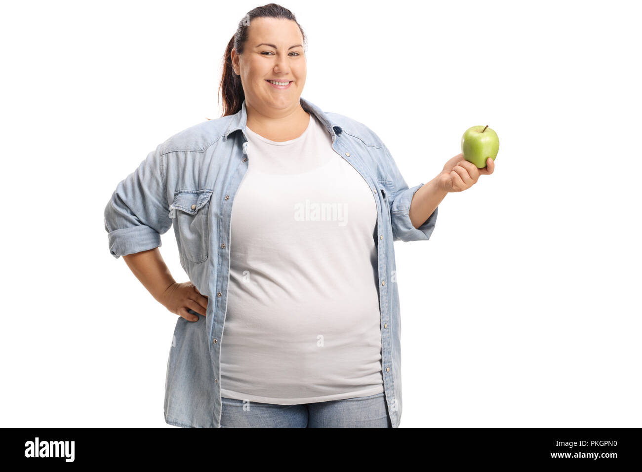 Übergewichtige Frau mit einem Apfel auf weißem Hintergrund Stockfoto