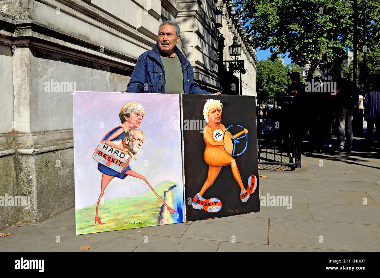 London, England, UK. Kaya Mar (Künstler) mit zwei Brexit Cartoons außerhalb der Downing Street während einer 3-stündigen Kabinettssitzung zu Brexit, Sept. 13 20 diskutieren Stockfoto