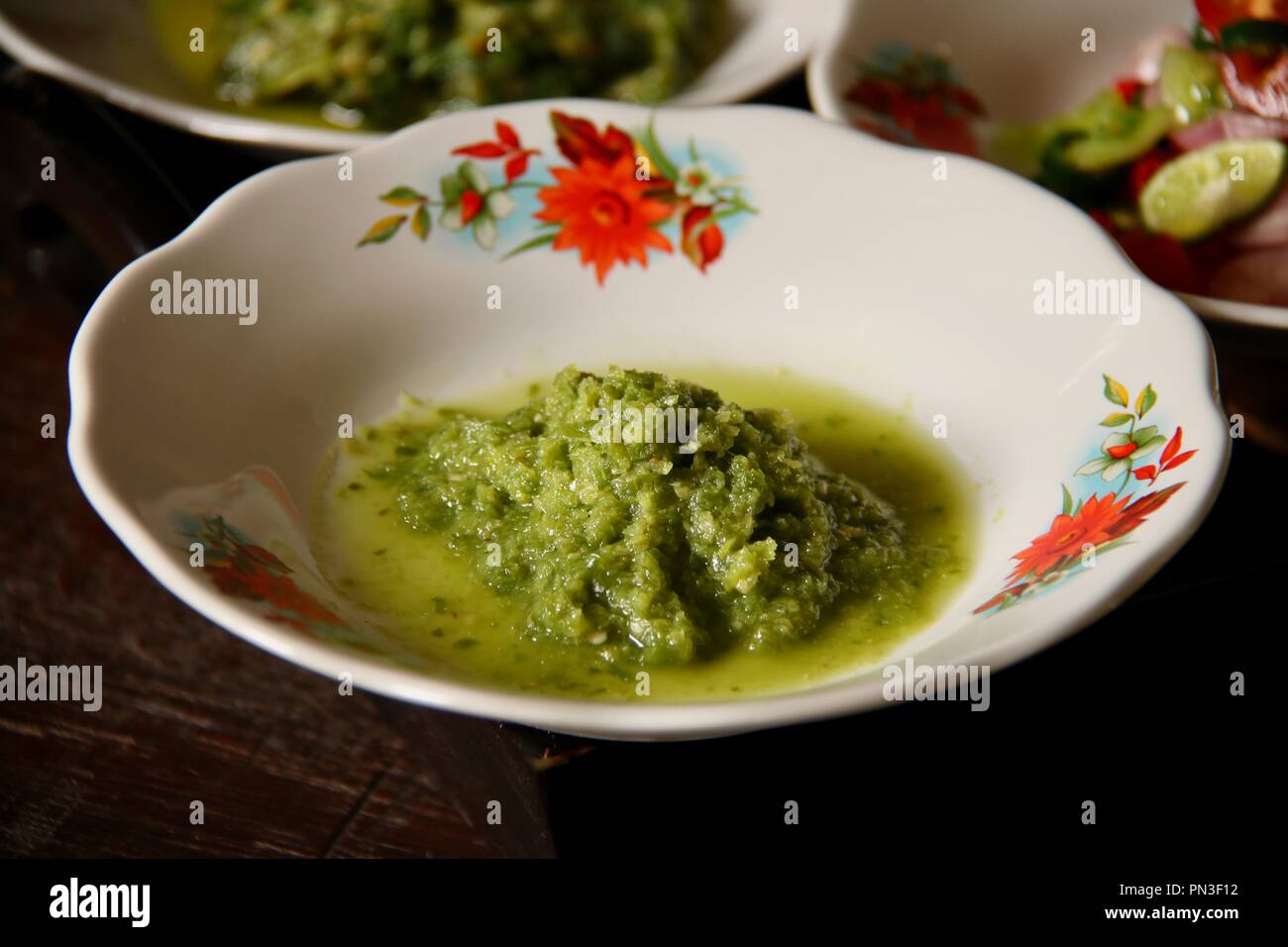 Sambal Andaliman, das würzige Soße grüne Chili und Paprika aus Andaliman Batak Küche, Nord Sumatra Stockfoto