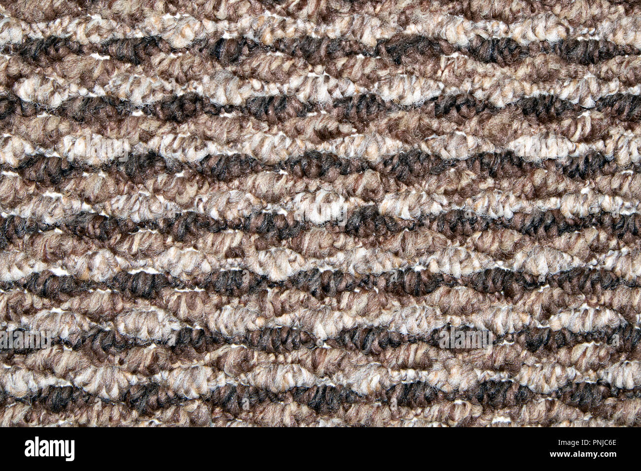 Braun und Beige synthetische Bodenbelag mit Welligen geometrische Muster, können als Hintergrund oder Textur verwendet werden. Stockfoto