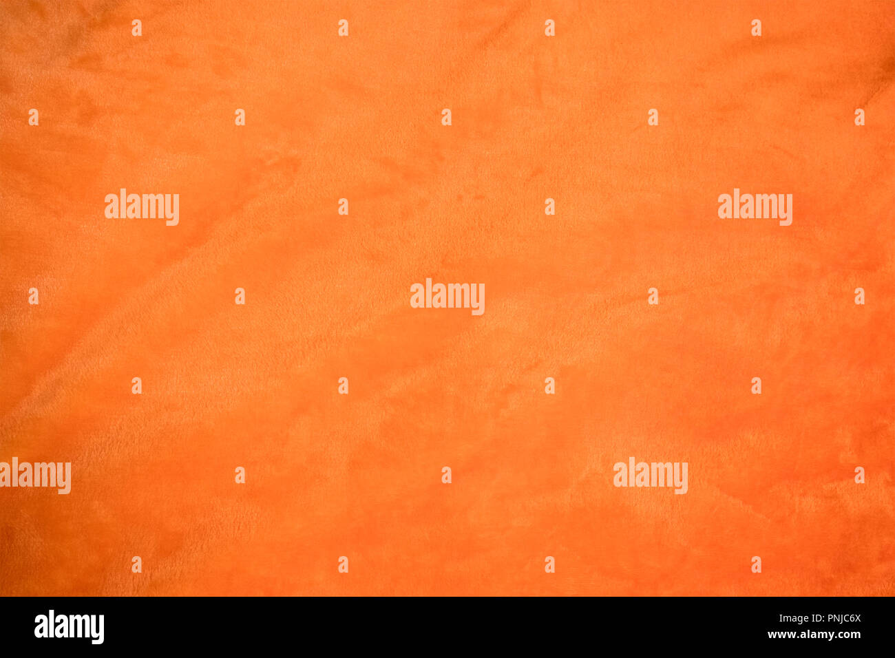 Jersey bright orange Stoff mit leichten Falten closeup, können als Hintergrund oder Textur verwendet werden. Stockfoto