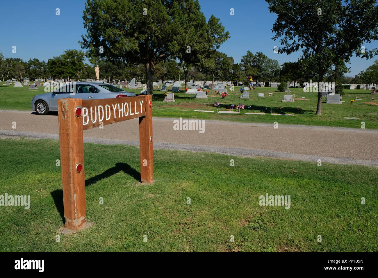 Zeichen Alarmierung Besucher auf die Lage der Buddy Holly Grabstätte auf dem Friedhof der Stadt in Lubbock, Texas, USA. Stockfoto