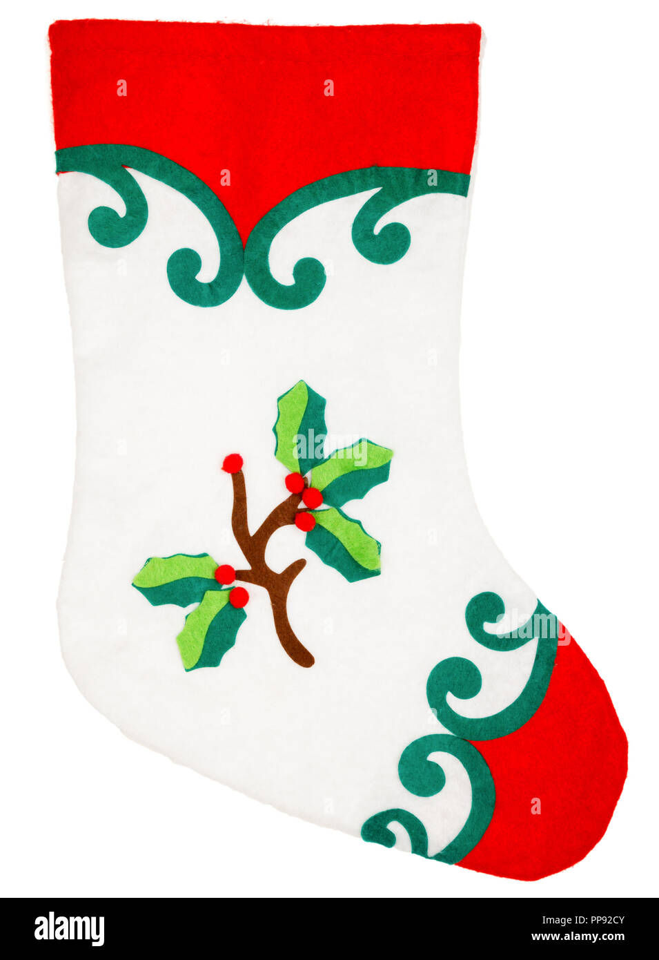 Rot und Weiß Plüsch Weihnachtsstrumpf mit Stechpalme Ornament auf weißem Hintergrund Stockfoto