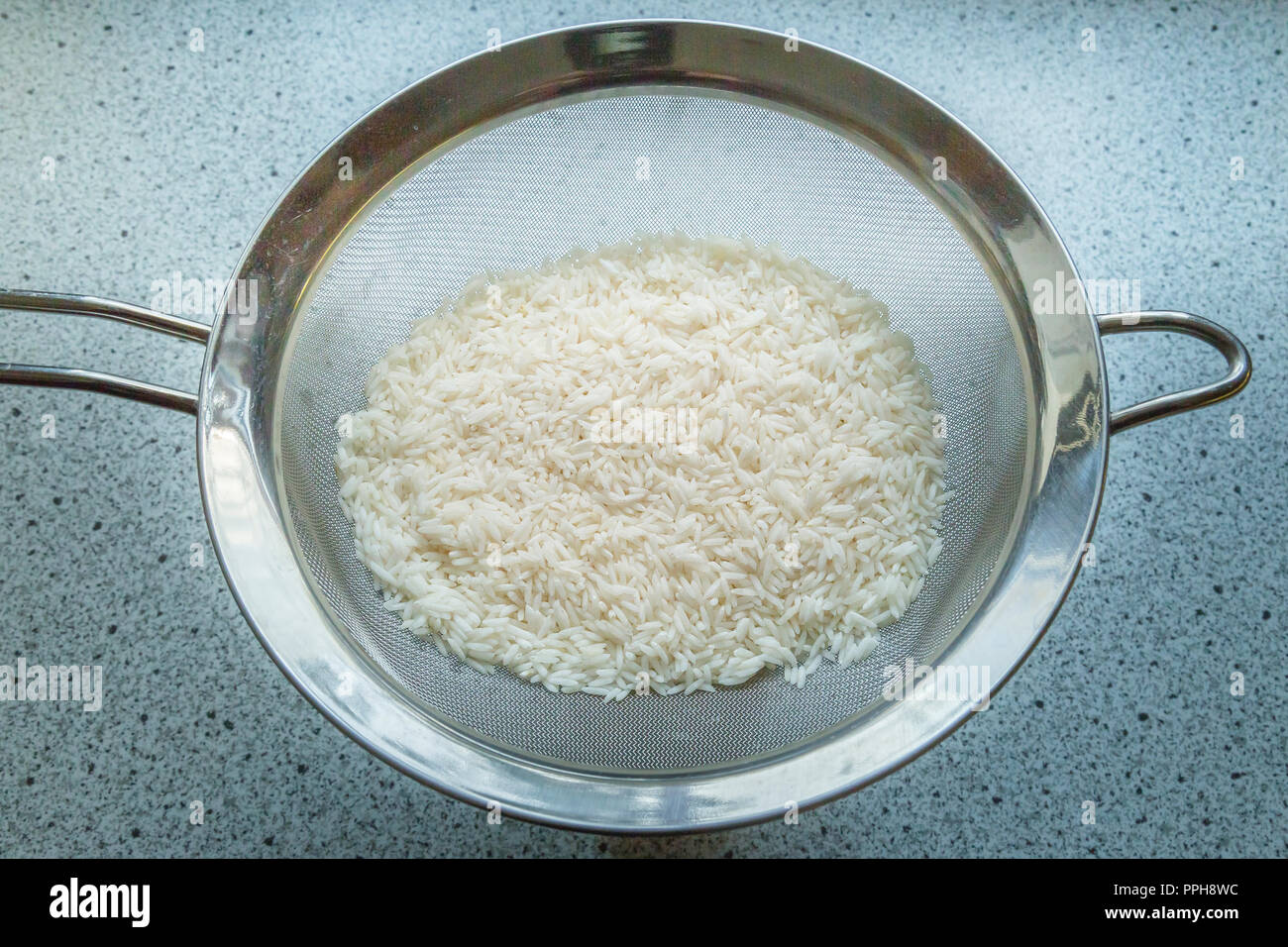 Kochen von Reis Stockfoto