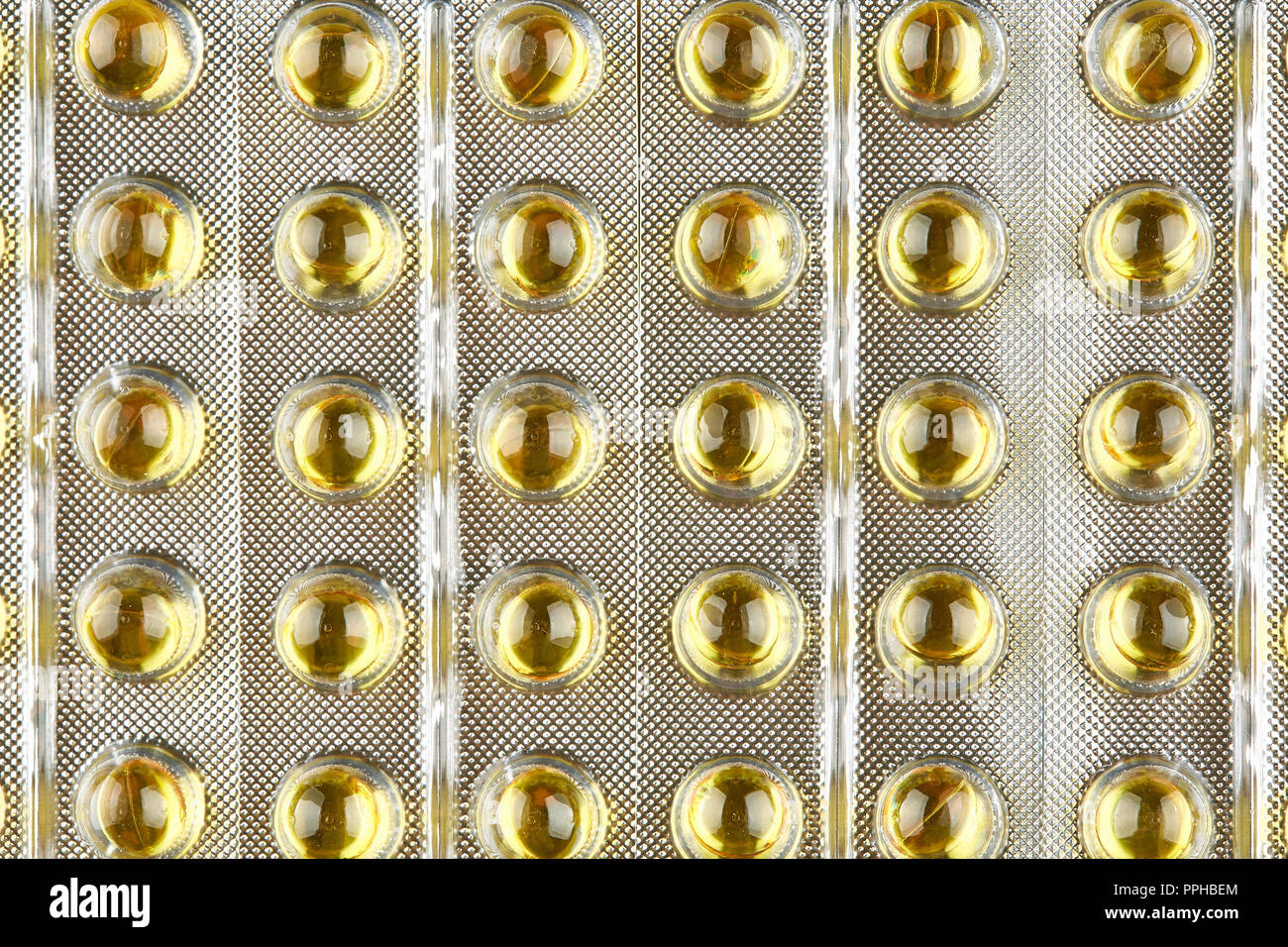 Versiegelte Packung mit transparenter Kapseln. Makro Hintergrund. Stockfoto