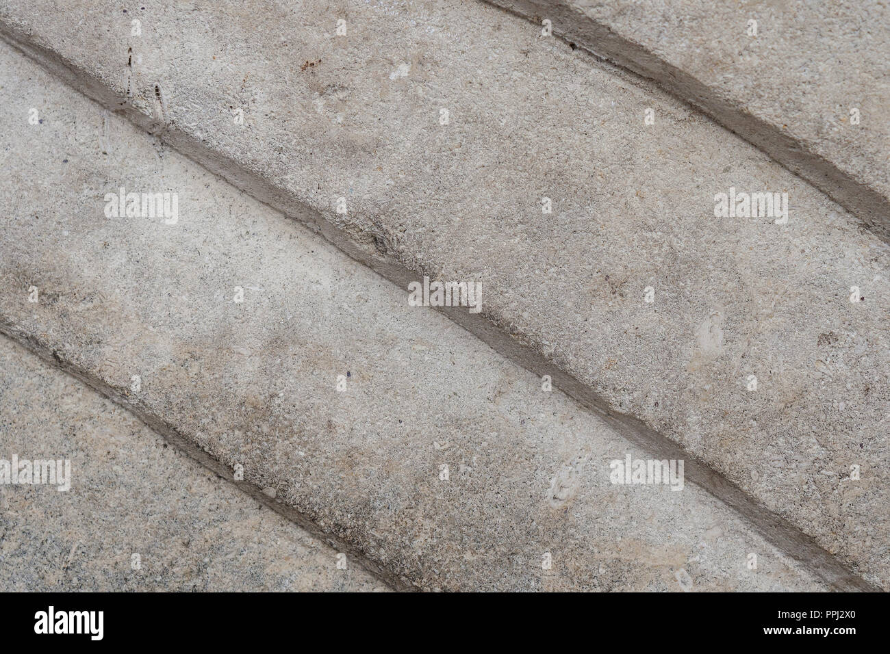 Alte sandy groben Stein. Strukturelle Hintergrund. Close-up. Stockfoto