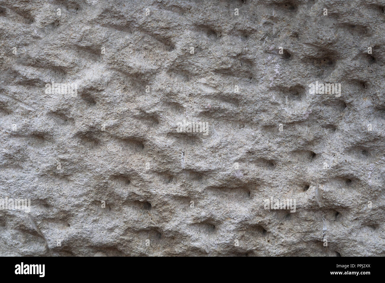 Alte sandy groben Stein. Strukturelle Hintergrund. Close-up. Stockfoto