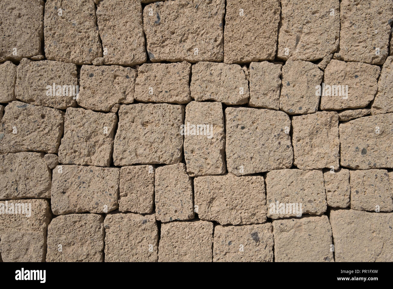 Ignimbrite Steinmauer - Naturstein Wand Hintergrund, Stockfoto