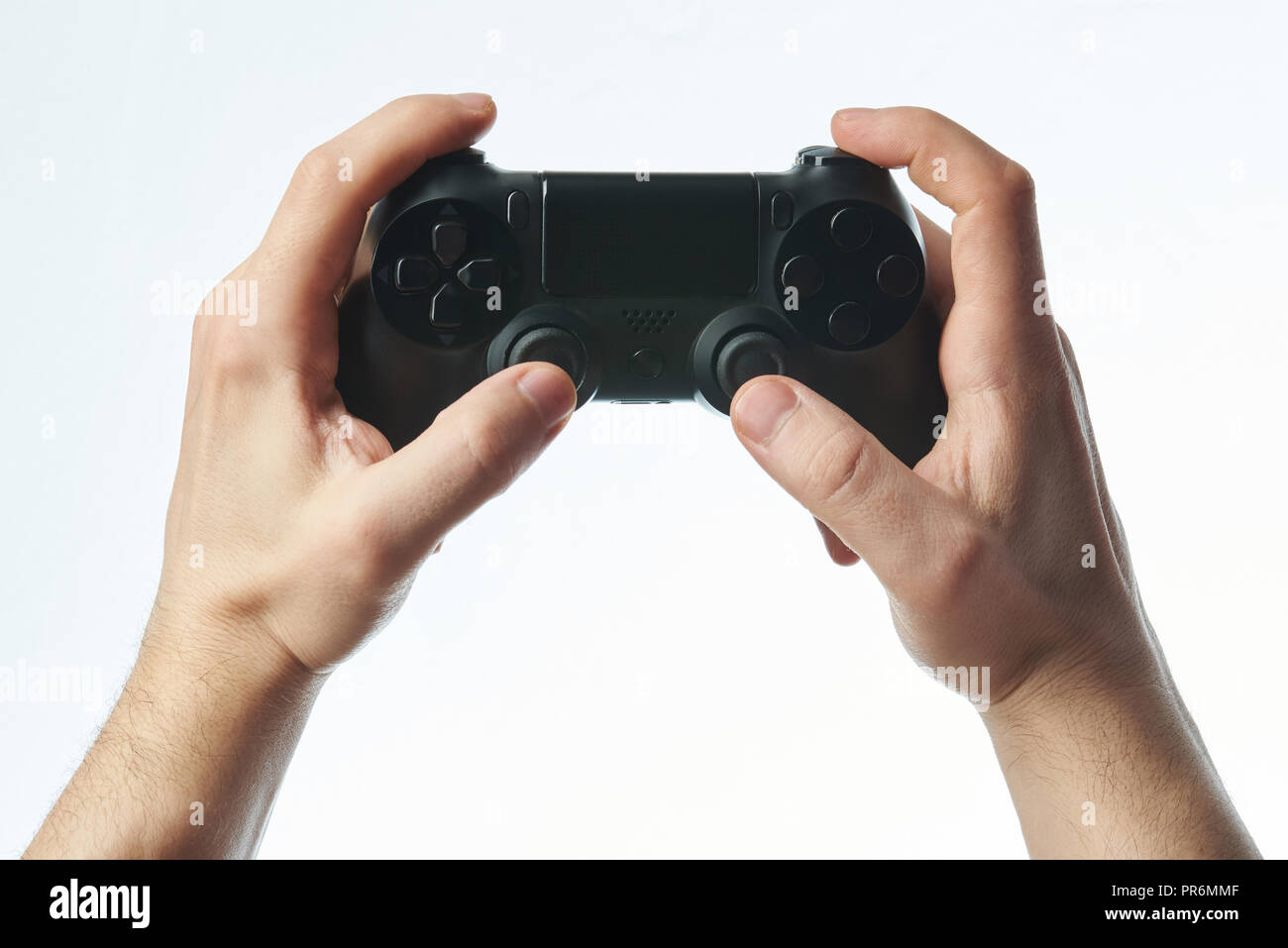 Schwarz Joystick in der Hand auf weißem Hintergrund Stockfoto