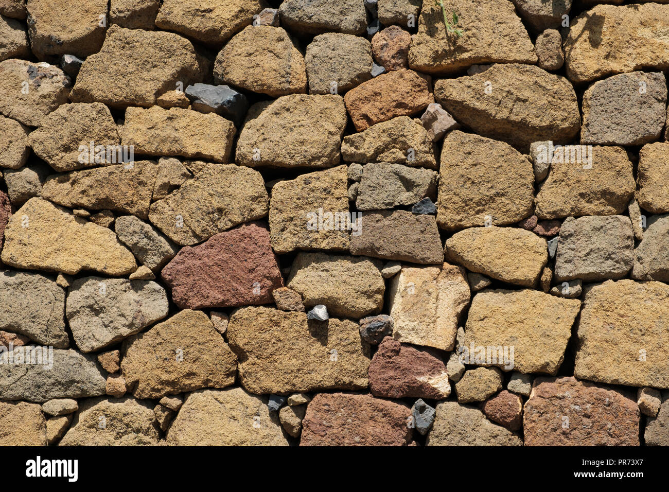 Natursteinmauer Hintergrund. Textur einer Steinmauer - Stockfoto