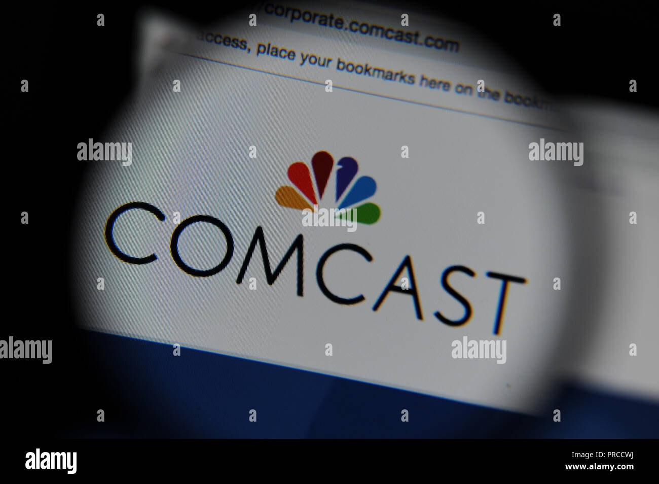 Die Comcast Website durch ein Vergrößerungsglas gesehen Stockfoto