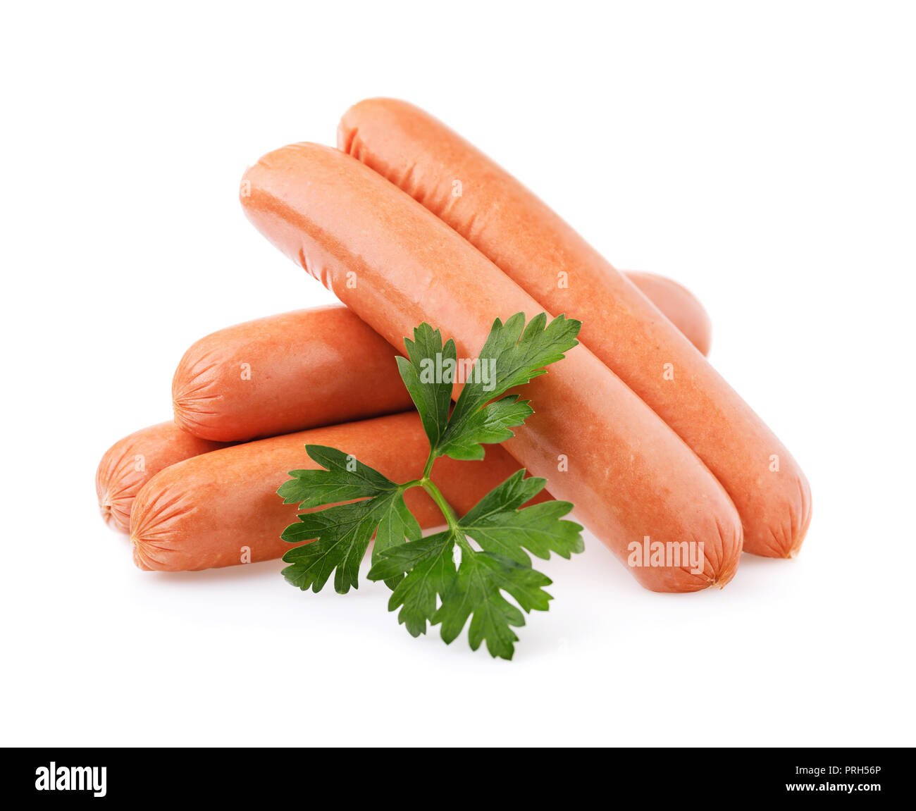 Mehrere frische Würste und Blatt frische Petersilie auf weißem Hintergrund Stockfoto